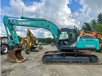 Pásové rýpadlo NEW HOLLAND