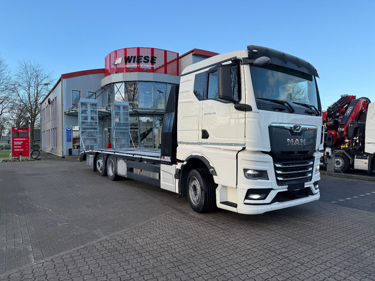 MAN Baumaschinen- Arbeitsbühnentransporter Rampen - Nákladné vozidlo na prepravu automobilov: obrázok 2 MAN Baumaschinen- Arbeitsbühnentransporter Rampen - Nákladné vozidlo na prepravu automobilov: obrázok 2