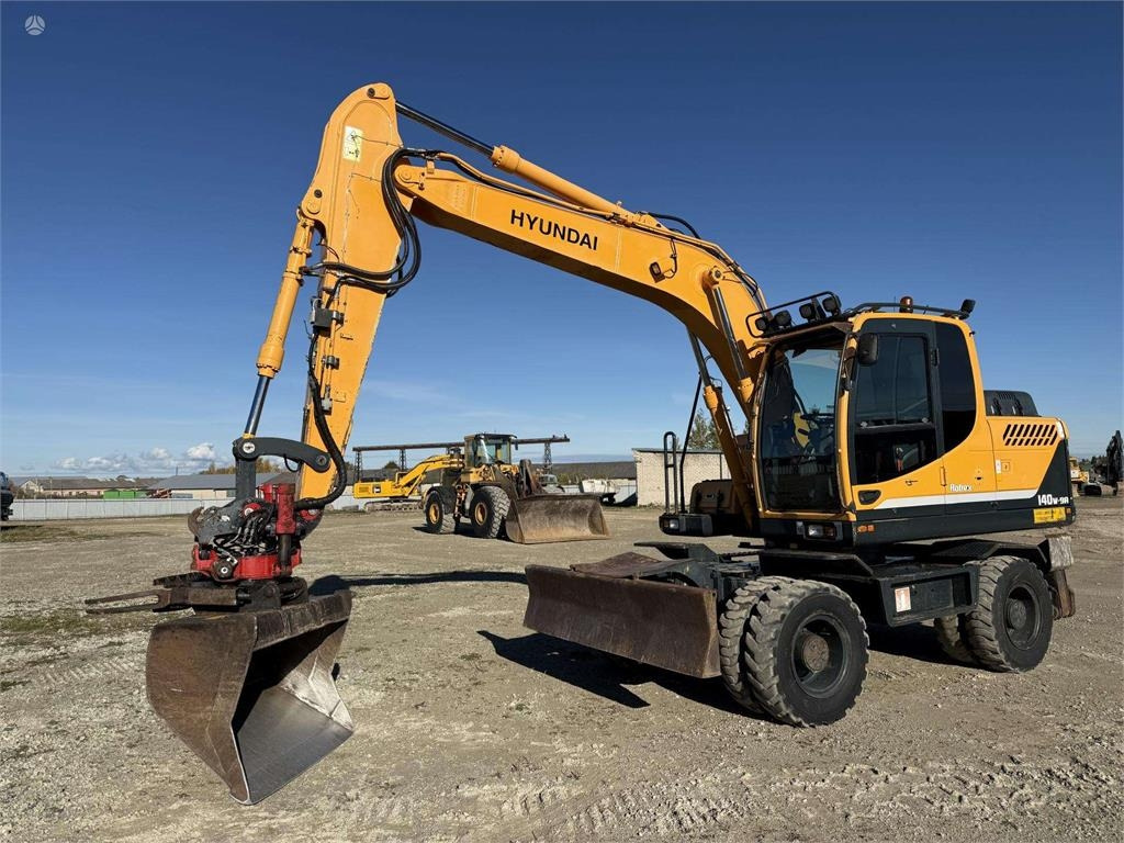 Hyundai Robex 140 W-9A Rototilt + grap - Kolesové rýpadlo: obrázok 1 Hyundai Robex 140 W-9A Rototilt + grap - Kolesové rýpadlo: obrázok 1