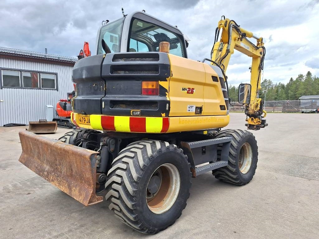 New Holland MYYTY! SOLD! MH2.6 ENGCON PIHDEILLÄ - Kolesové rýpadlo: obrázok 4 New Holland MYYTY! SOLD! MH2.6 ENGCON PIHDEILLÄ - Kolesové rýpadlo: obrázok 4
