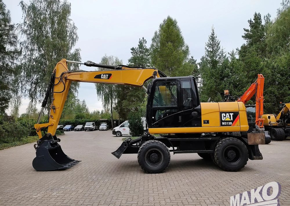 Caterpillar M313D - Kolesové rýpadlo: obrázok 1 Caterpillar M313D - Kolesové rýpadlo: obrázok 1