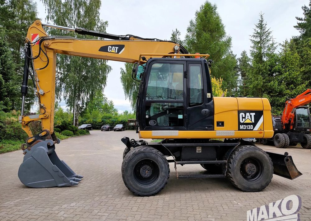 Caterpillar M313D - Kolesové rýpadlo: obrázok 1 Caterpillar M313D - Kolesové rýpadlo: obrázok 1
