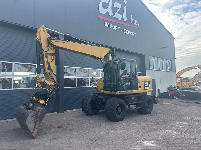 Caterpillar M313D - Kolesové rýpadlo: obrázok 1 Caterpillar M313D - Kolesové rýpadlo: obrázok 1