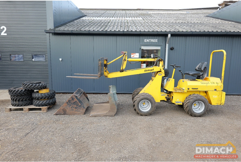 Striegel 150 DYA minishovel met 2 bakken en palletvorken en extra banden - Nakladač: obrázok 1 Striegel 150 DYA minishovel met 2 bakken en palletvorken en extra banden - Nakladač: obrázok 1