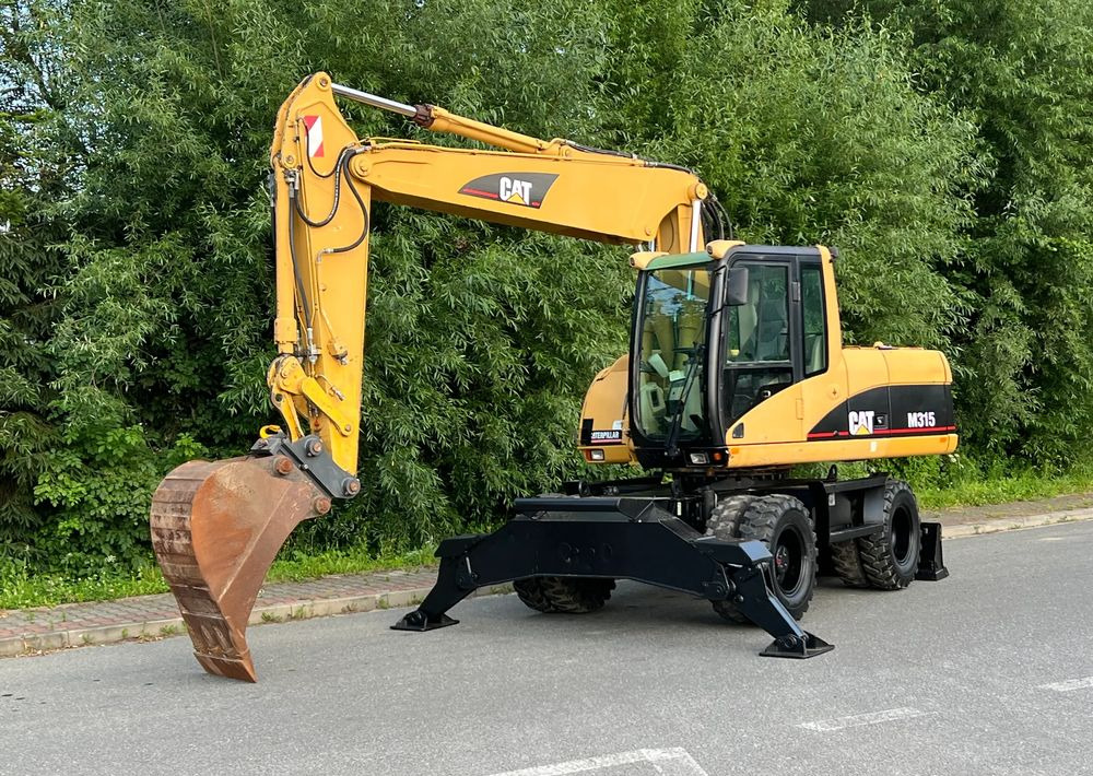 Caterpillar CAT M315C CATERPILLAR SPROWADZONY Bardzo Dobry Stan - Kolesové rýpadlo: obrázok 1 Caterpillar CAT M315C CATERPILLAR SPROWADZONY Bardzo Dobry Stan - Kolesové rýpadlo: obrázok 1
