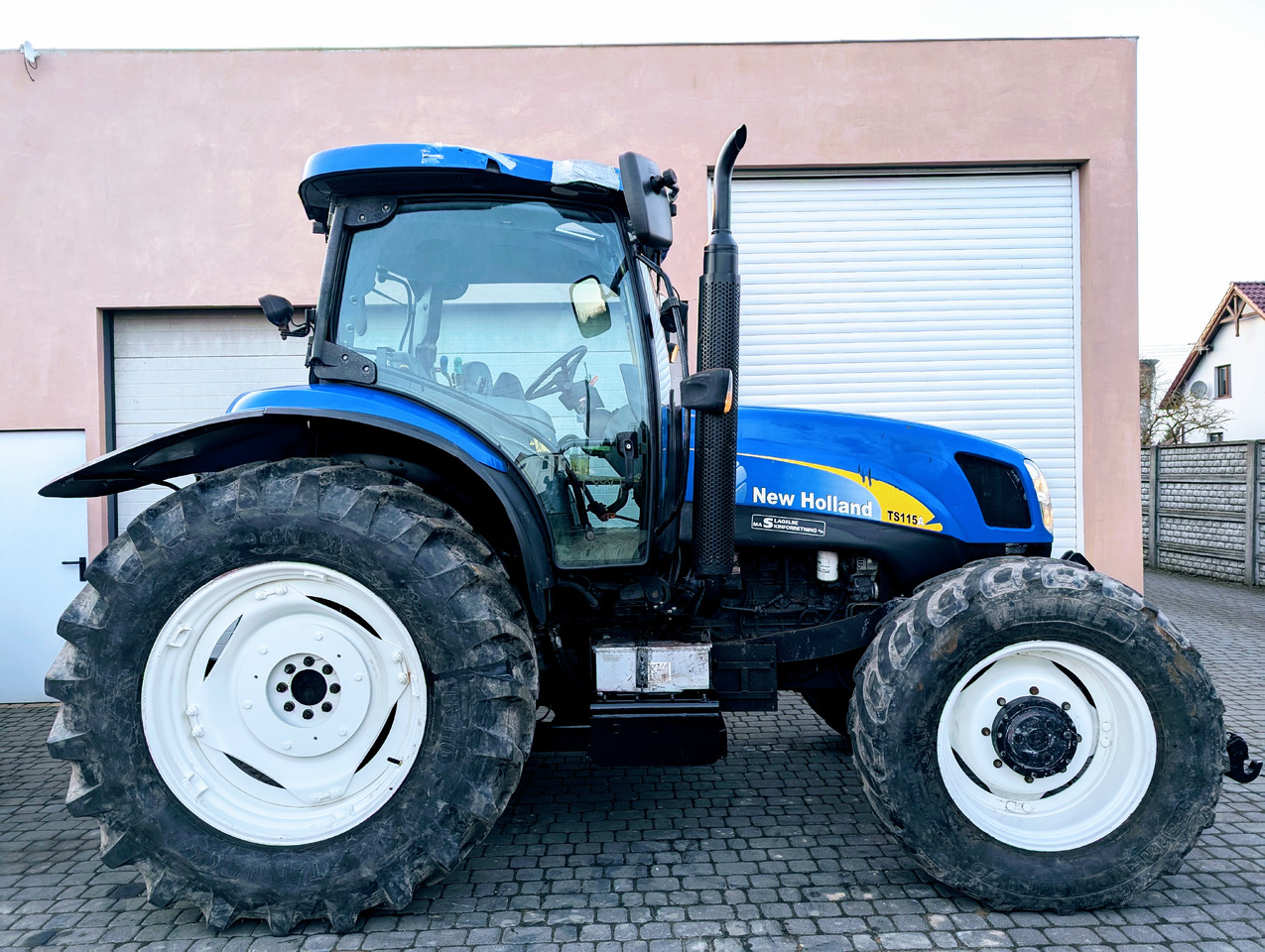 New Holland TS115A - Traktor: obrázok 1 New Holland TS115A - Traktor: obrázok 1