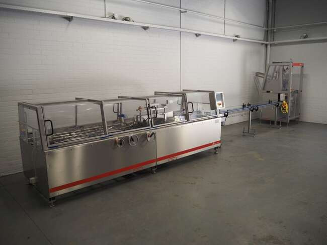 Schut Systems carton line EM60 - Baliaci stroj: obrázok 1 Schut Systems carton line EM60 - Baliaci stroj: obrázok 1
