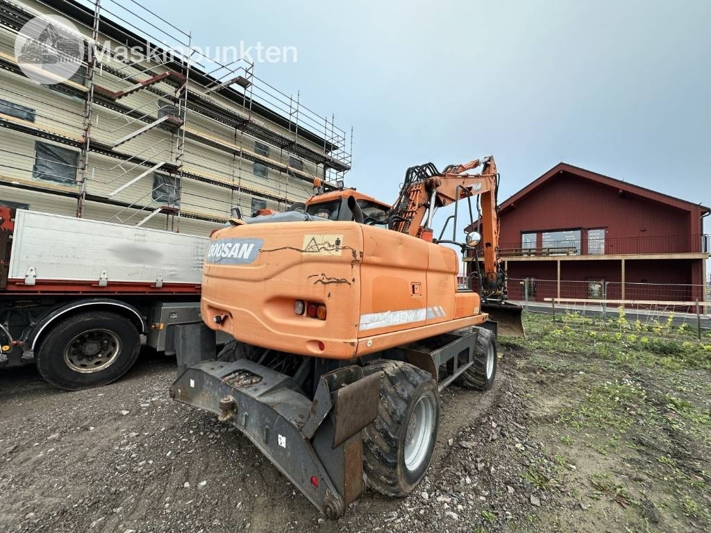 Doosan DX 140 W med vagn och redskap - Kolesové rýpadlo: obrázok 4 Doosan DX 140 W med vagn och redskap - Kolesové rýpadlo: obrázok 4