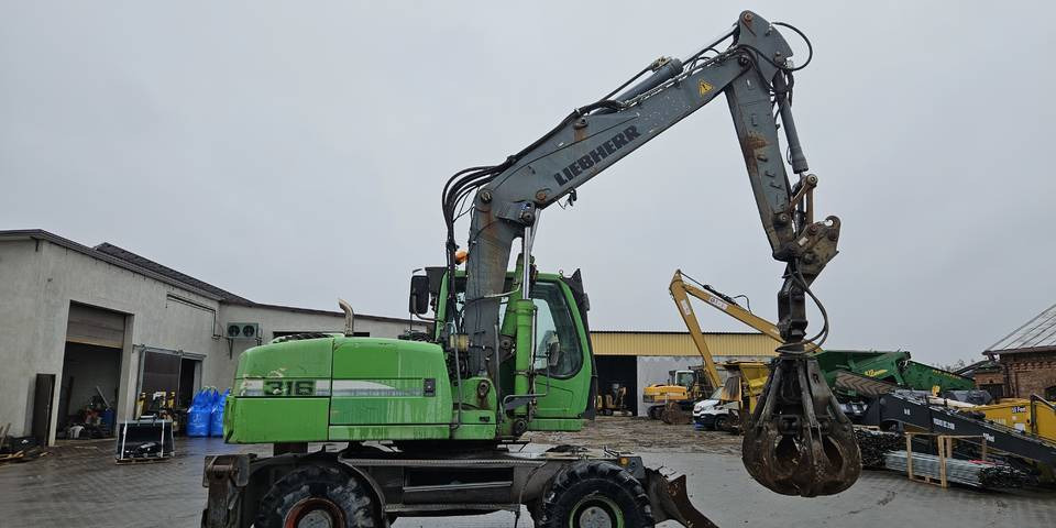 Koparka kołowa Liebherr A 316 Litronic chwytak podpory pług - Kolesové rýpadlo: obrázok 4 Koparka kołowa Liebherr A 316 Litronic chwytak podpory pług - Kolesové rýpadlo: obrázok 4