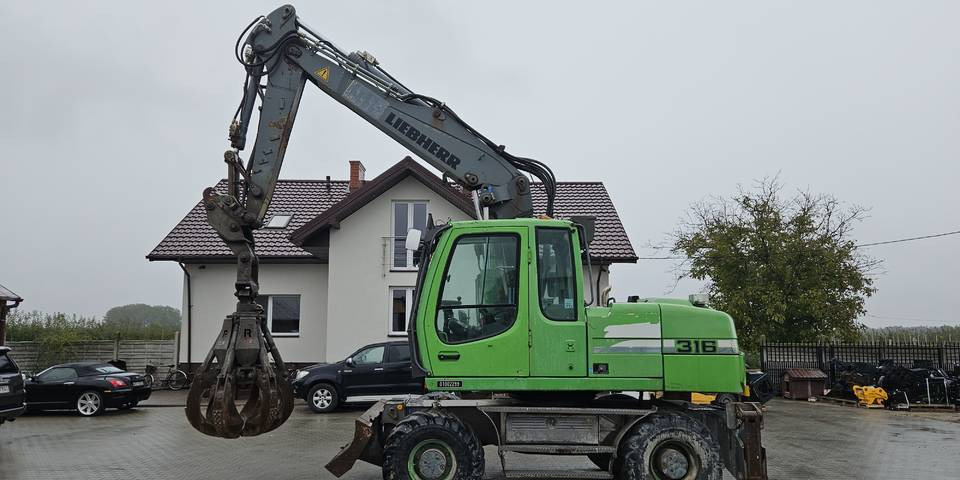 Koparka kołowa Liebherr A 316 Litronic chwytak podpory pług - Kolesové rýpadlo: obrázok 1 Koparka kołowa Liebherr A 316 Litronic chwytak podpory pług - Kolesové rýpadlo: obrázok 1