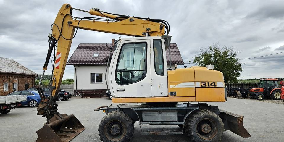 Koparka kołowa Liebherr A314 Litronic 9350 h 4 łyżki kołówka - Kolesové rýpadlo: obrázok 1 Koparka kołowa Liebherr A314 Litronic 9350 h 4 łyżki kołówka - Kolesové rýpadlo: obrázok 1