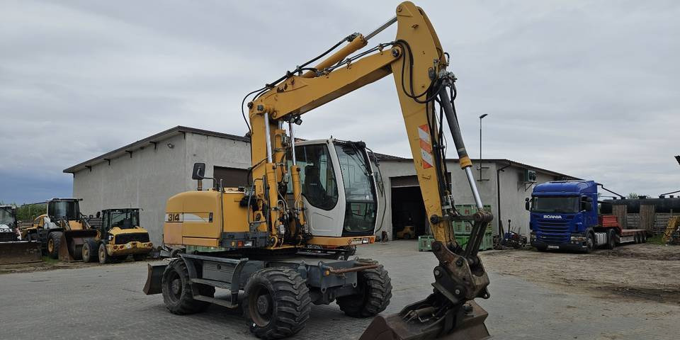 Koparka kołowa Liebherr A314 Litronic 9350 h 4 łyżki kołówka - Kolesové rýpadlo: obrázok 4 Koparka kołowa Liebherr A314 Litronic 9350 h 4 łyżki kołówka - Kolesové rýpadlo: obrázok 4