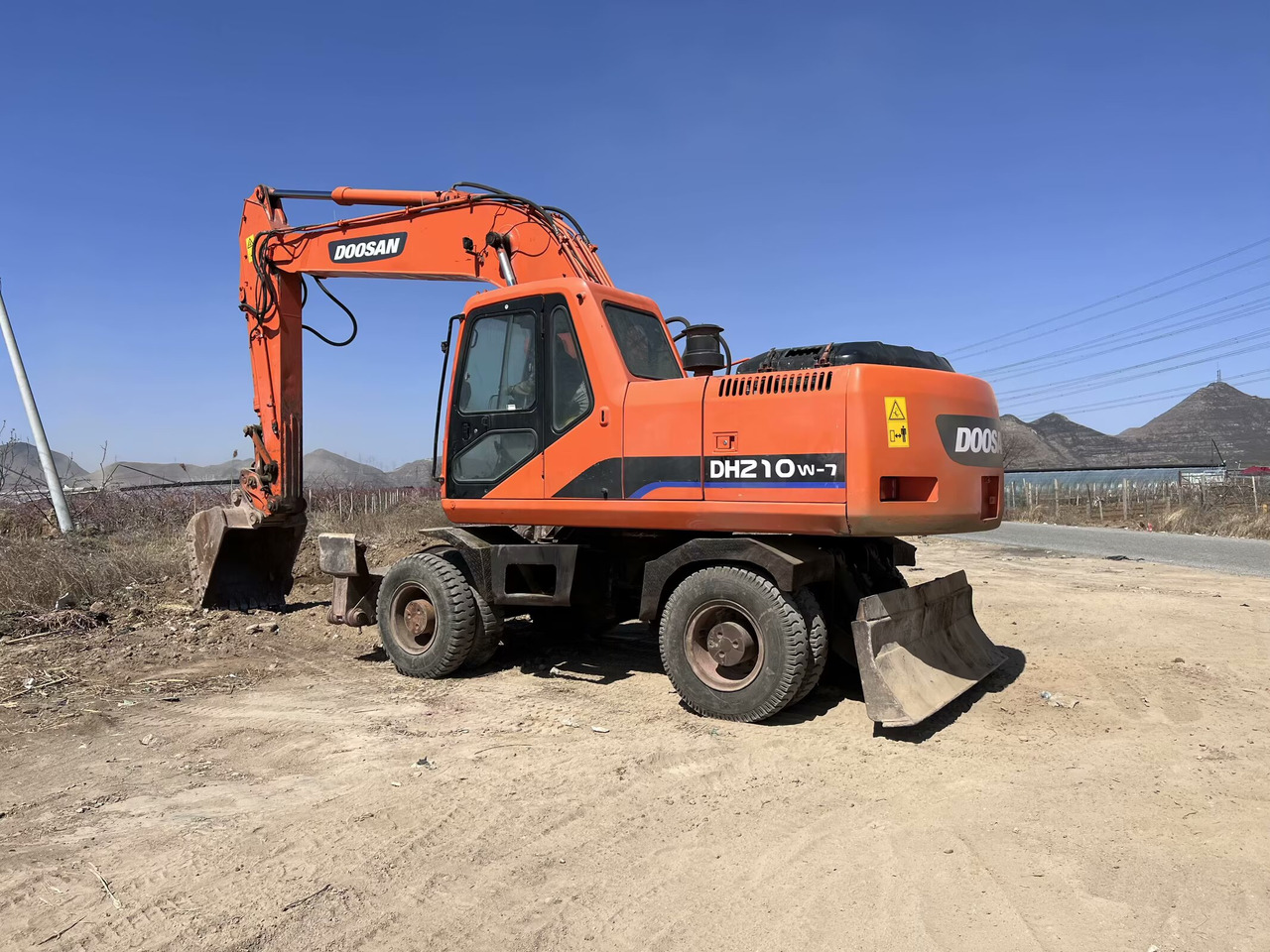 DOOSAN DH210W-7 - Kolesové rýpadlo: obrázok 1 DOOSAN DH210W-7 - Kolesové rýpadlo: obrázok 1