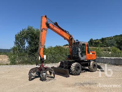 HITACHI ZX130W Pelle Sur Pneus - Překládkové rýpadlo: obrázok 1 HITACHI ZX130W Pelle Sur Pneus - Překládkové rýpadlo: obrázok 1