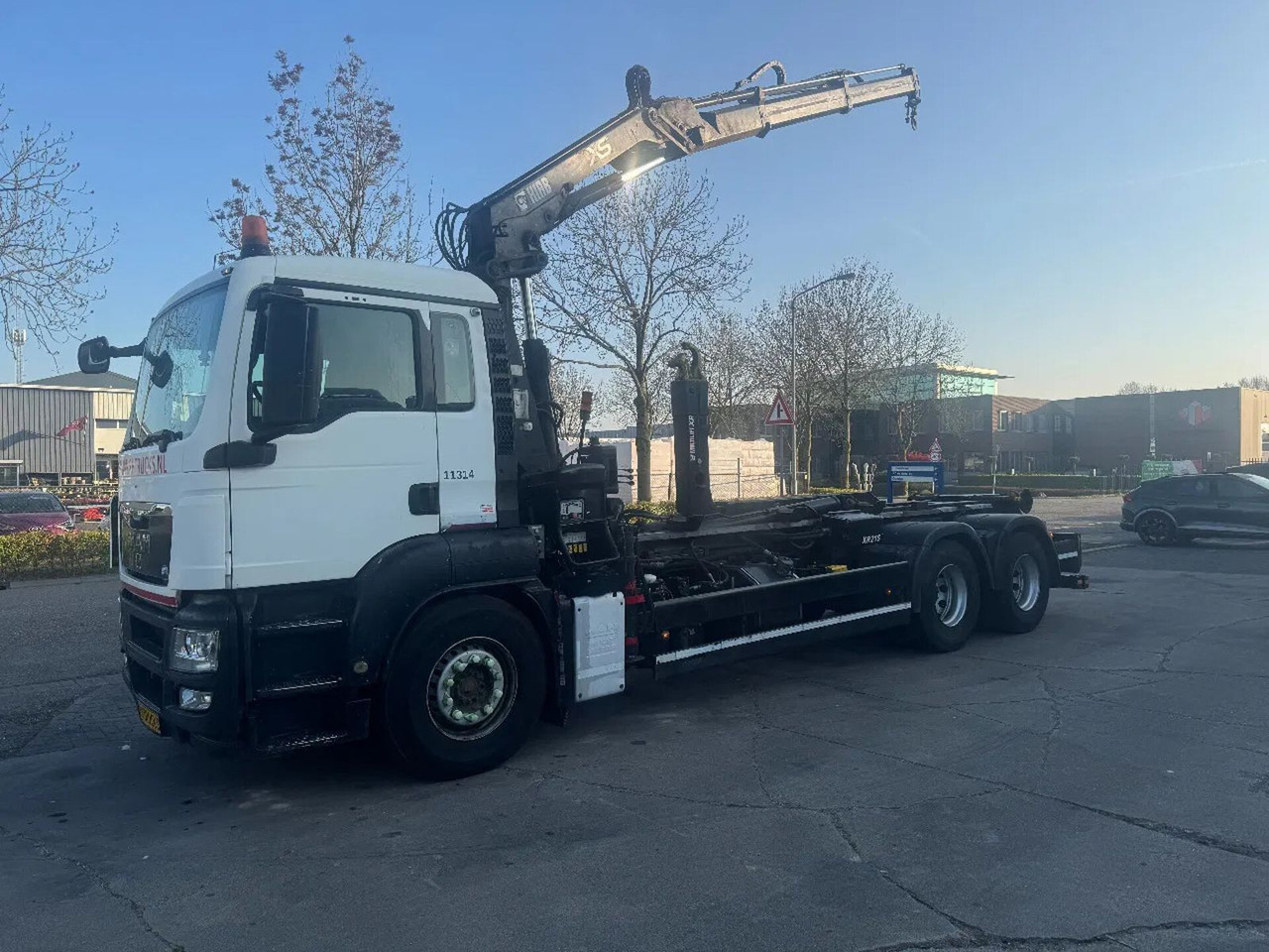 MAN TGS 26.360 6X4 VDL 21T HOOK + HIAB 122 + REMOTE - Hákový nosič kontajnerov: obrázok 1 MAN TGS 26.360 6X4 VDL 21T HOOK + HIAB 122 + REMOTE - Hákový nosič kontajnerov: obrázok 1