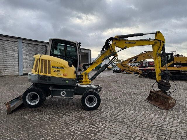 Neuson EW65, Verstellausleger, Hydr. S.W.S.,Div. Löffel - Kolesové rýpadlo: obrázok 5 Neuson EW65, Verstellausleger, Hydr. S.W.S.,Div. Löffel - Kolesové rýpadlo: obrázok 5